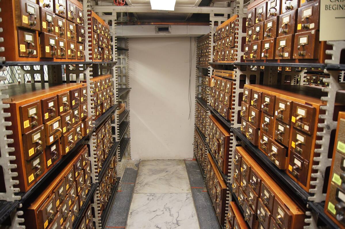 a corridor of card catalogue drawers