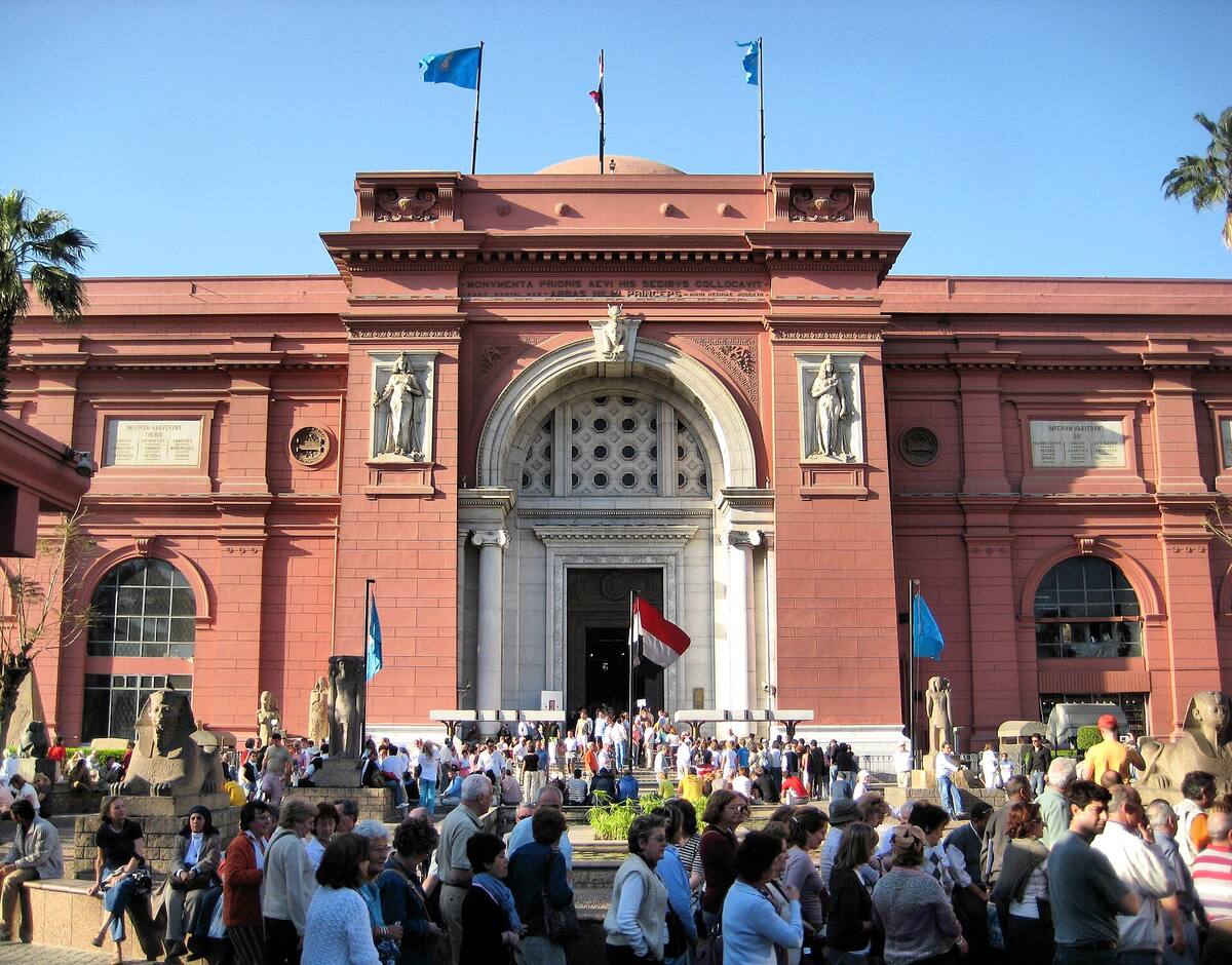 a crowd arriving at a museum